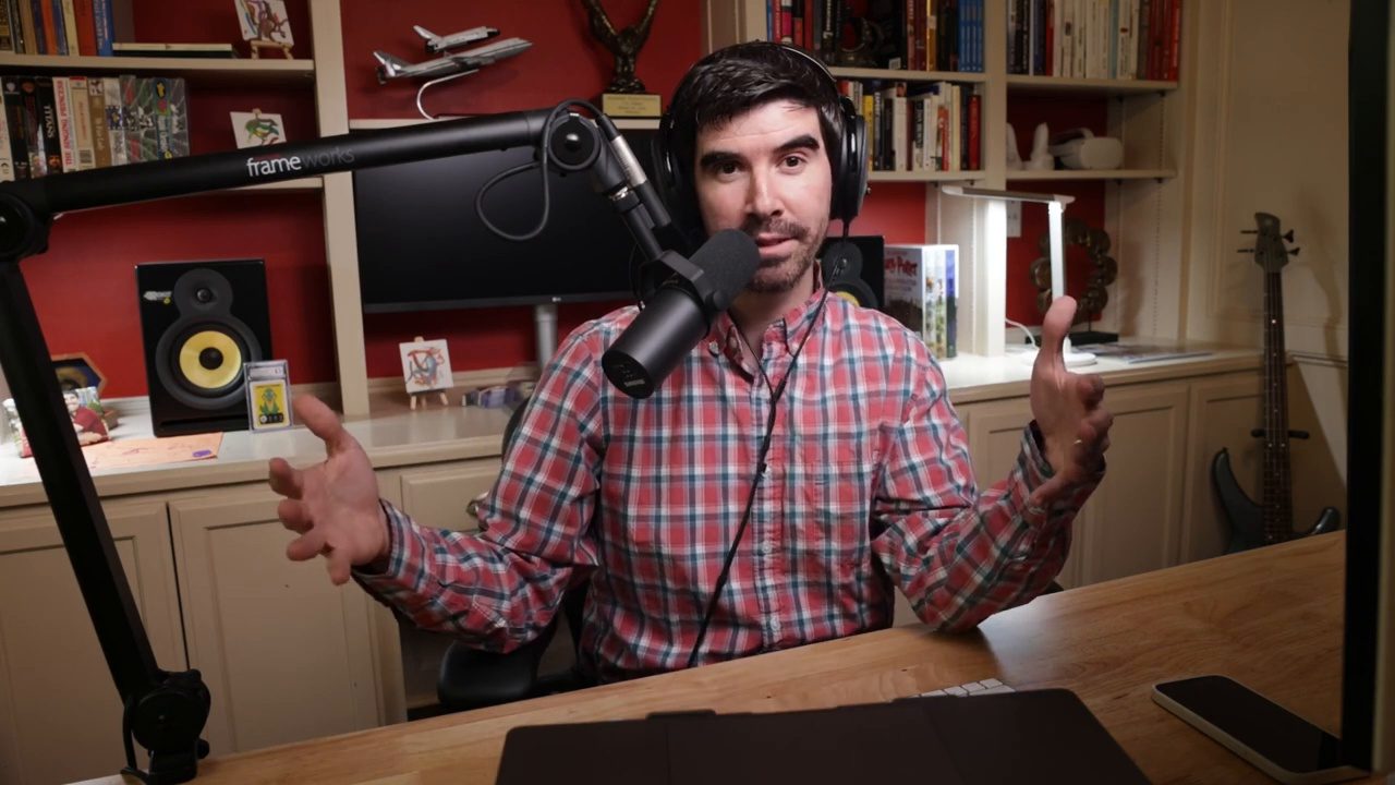 Armando J. Perez-Carreno in a red plaid shirt talking into a microphone on episode 14 of The Web Talk Show