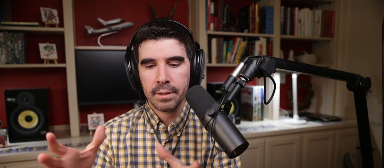 Armando J. Perez-Carreno in a yellow plaid shirt talking into a microphone on episode 20 of The Web Talk Show