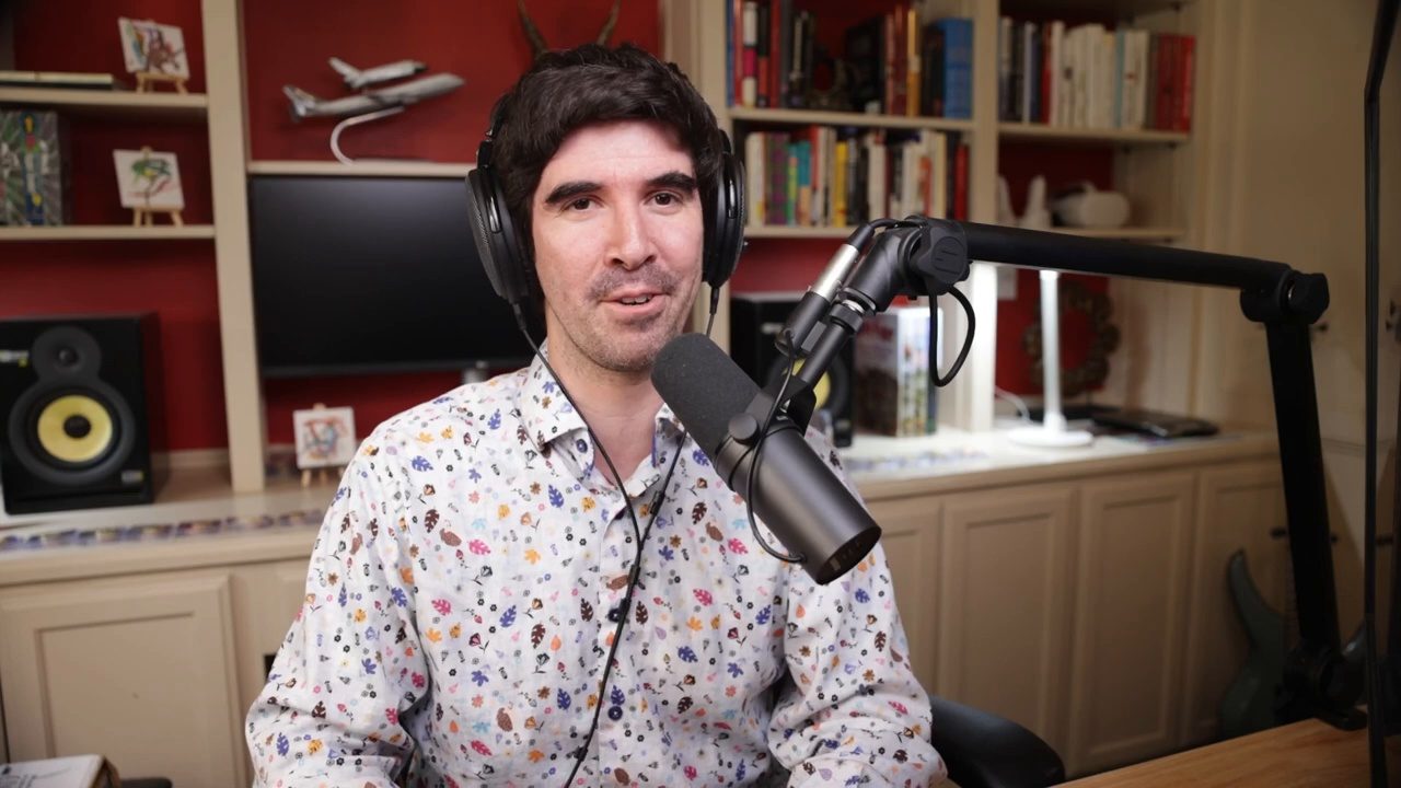 Armando J. Perez-Carreno in a white patterned shirt talking into a microphone on episode 22 of The Web Talk Show