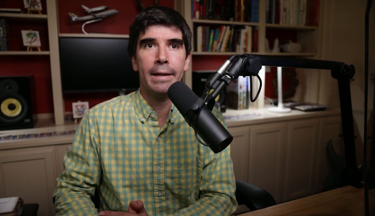 Armando J. Perez-Carreno in a green checked shirt talking into a microphone on episode 23 of The Web Talk Show