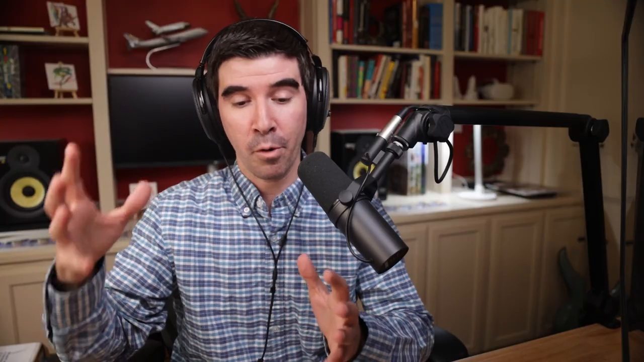 Armando J. Perez-Carreno in a blue gingham shirt talking into a microphone on episode 24 of The Web Talk Show