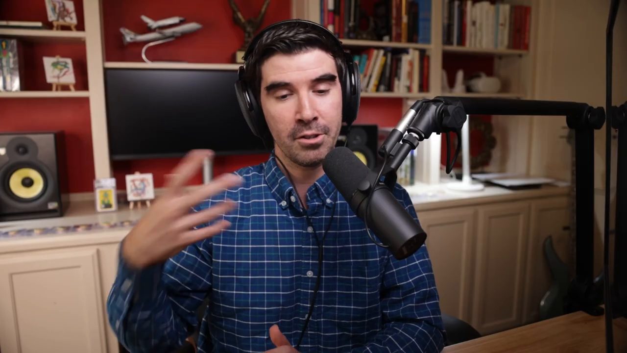 Armando J. Perez-Carreno in a navy checked shirt talking into a microphone on episode 26 of The Web Talk Show