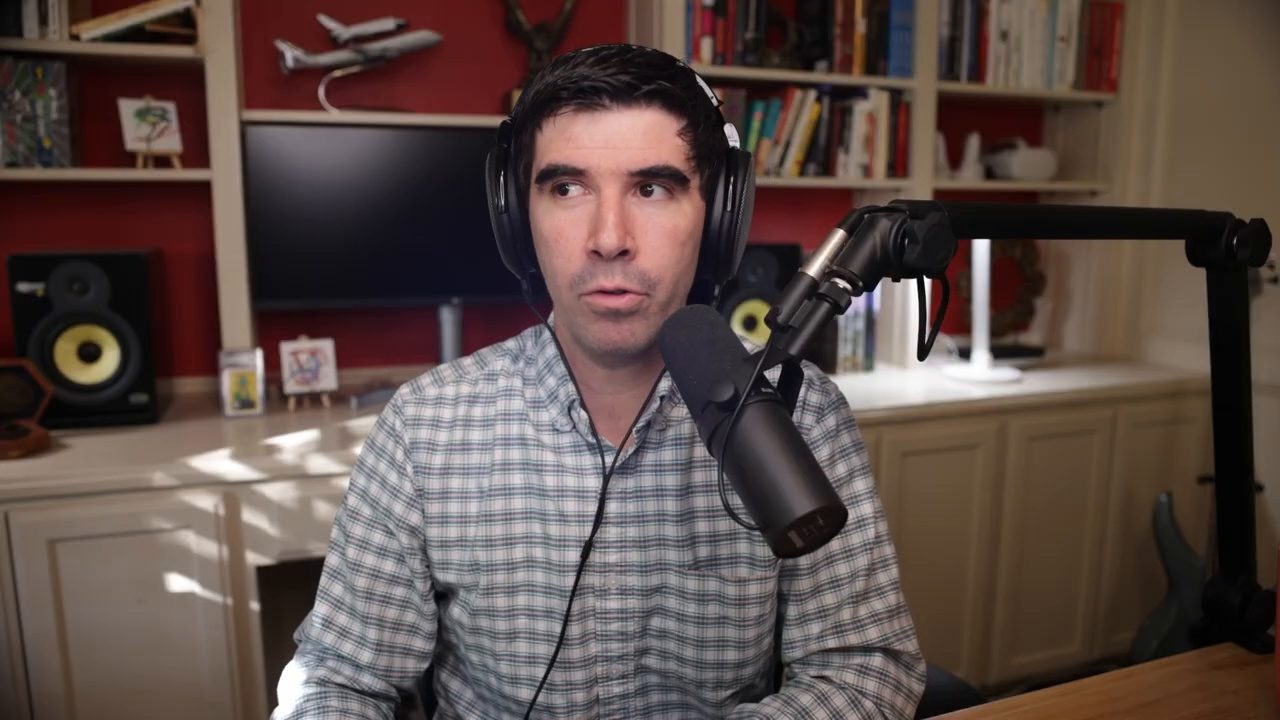 Armando J. Perez-Carreno in a light blue gingham shirt talking into a microphone on episode 32 of The Web Talk Show