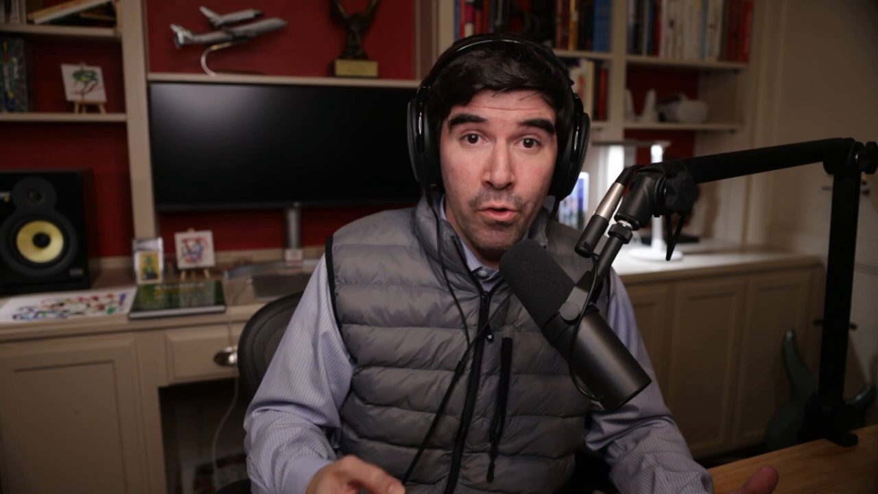 Armando J. Perez-Carreno in a gray vest over a blue shirt talking into a microphone on episode 39 of The Web Talk Show