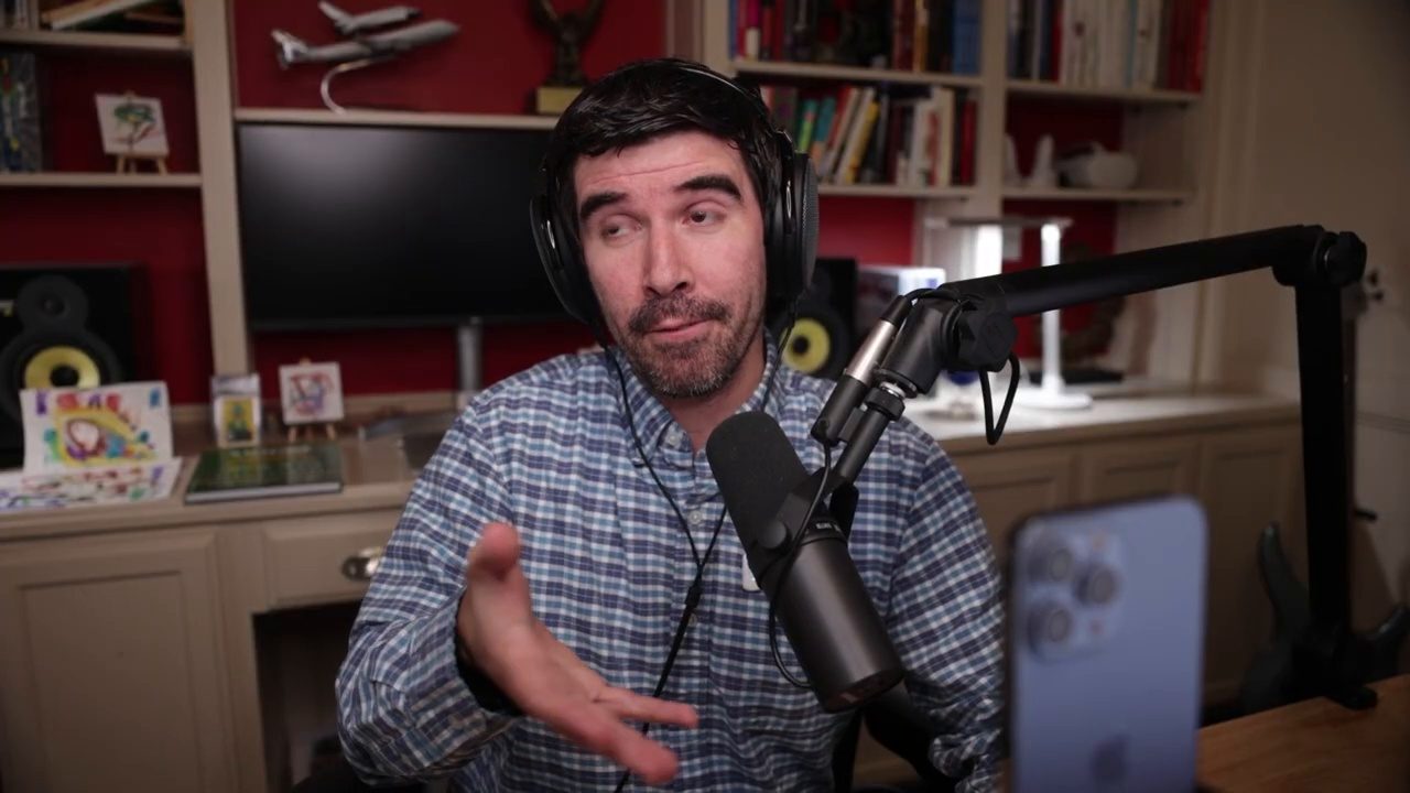 Armando J. Perez-Carreno in a blue plaid shirt talking into a microphone on episode 46 of The Web Talk Show