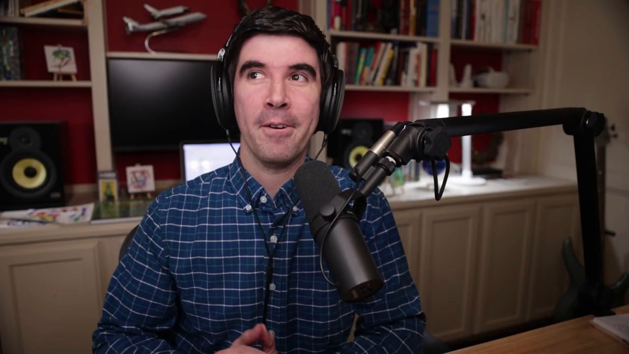 Armando J. Perez-Carreno in a navy checked shirt talking into a microphone on episode 53 of The Web Talk Show
