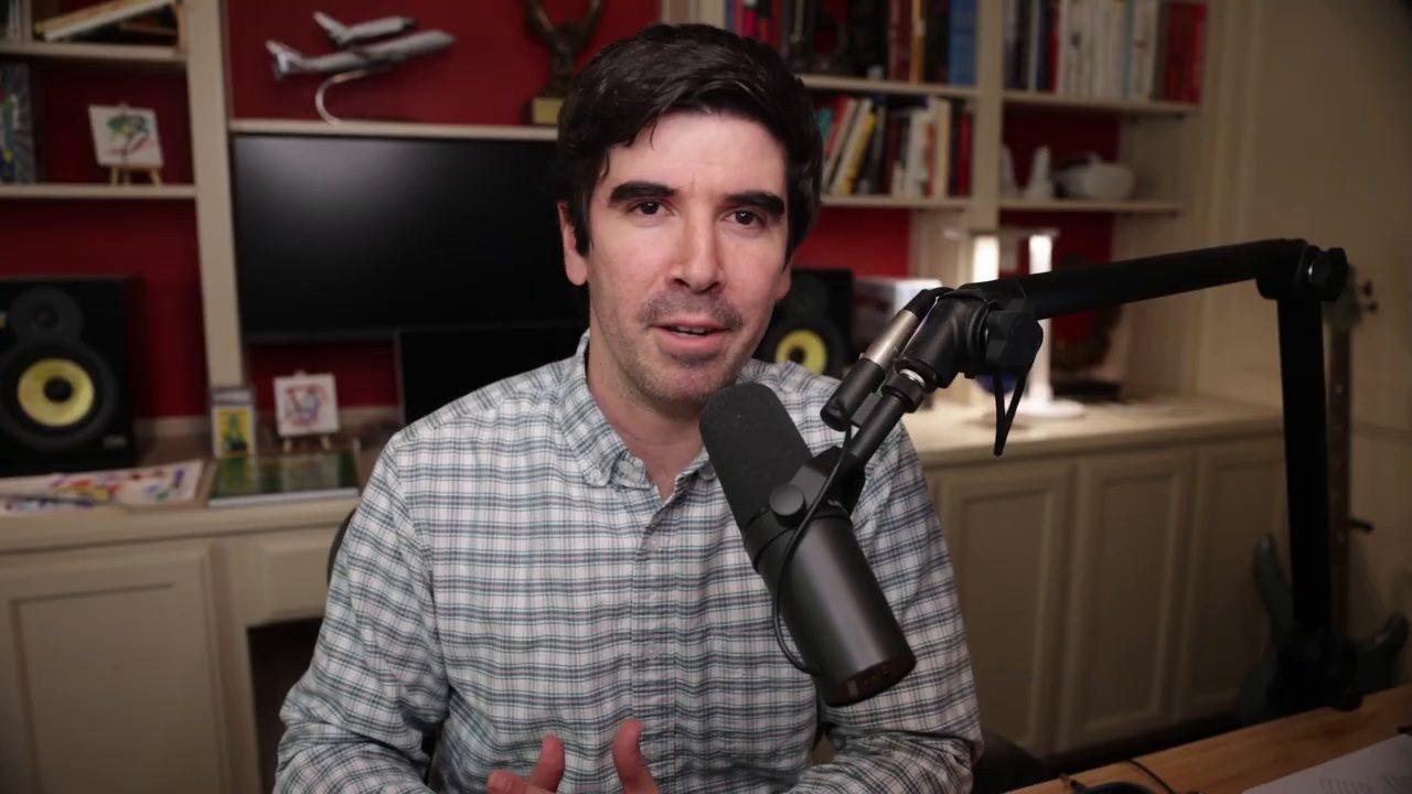Armando J. Perez-Carreno in a gray gingham shirt talking into a microphone on episode 68 of The Web Talk Show