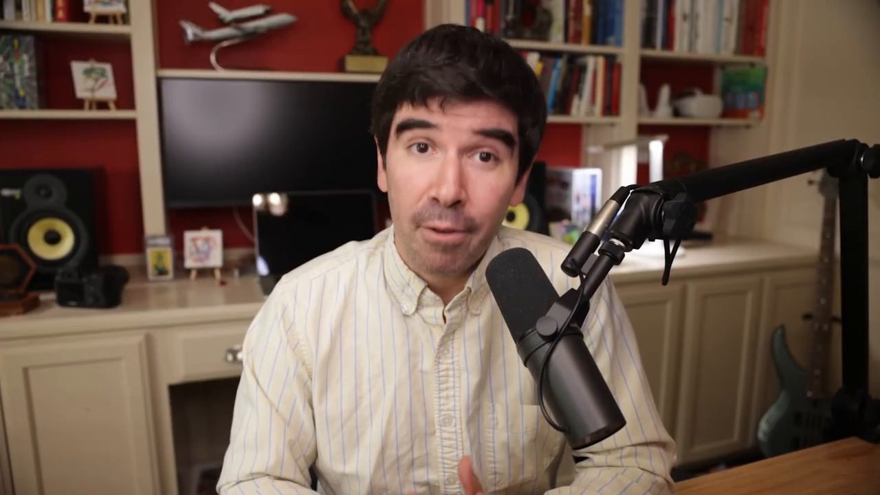 Armando J. Perez-Carreno in a cream button-down shirt talking into a microphone on episode 79 of The Web Talk Show