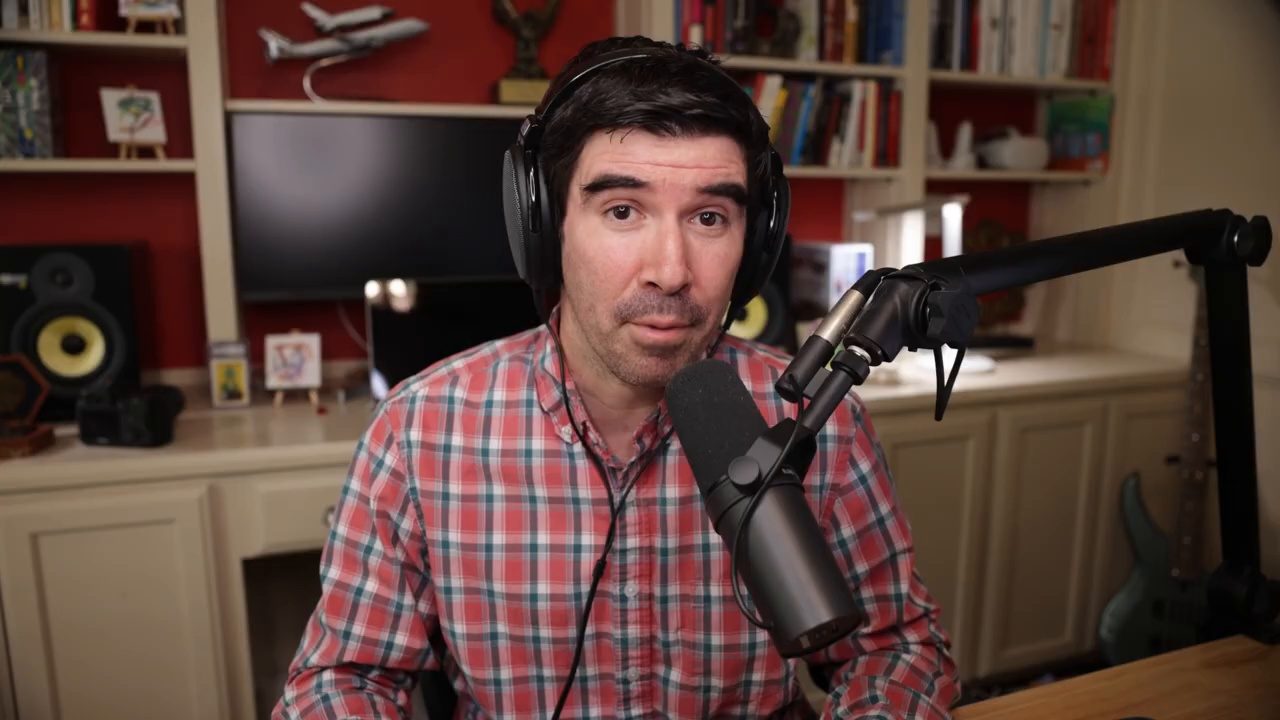 Armando J. Perez-Carreno in a red plaid shirt talking into a microphone on episode 80 of The Web Talk Show