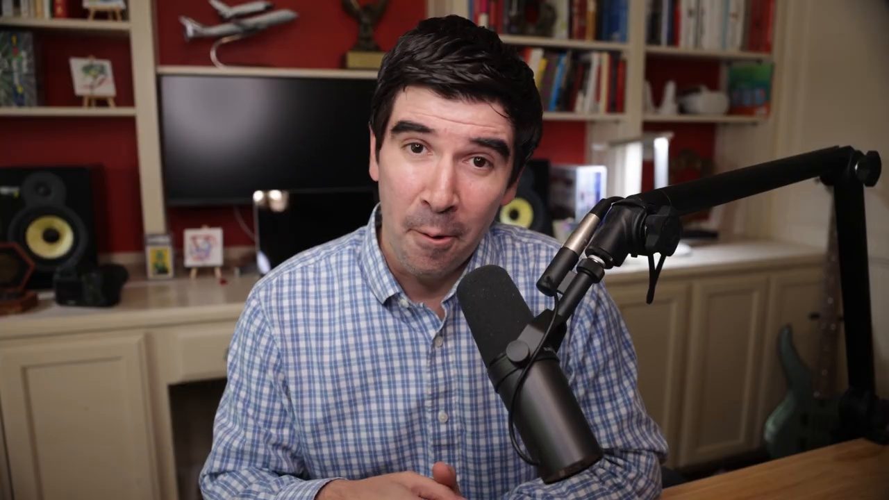 Armando J. Perez-Carreno in a blue checked shirt talking into a microphone on episode 82 of The Web Talk Show