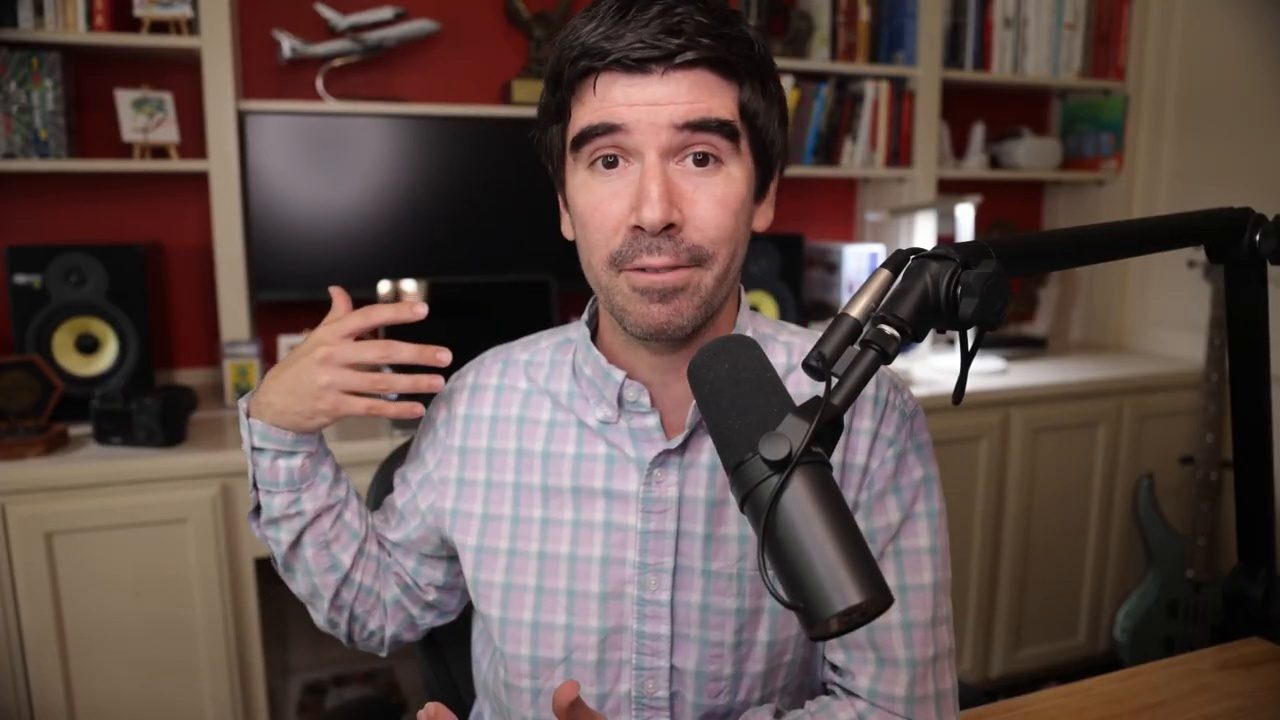 Armando J. Perez-Carreno in a light blue checked shirt talking into a microphone on episode 83 of The Web Talk Show